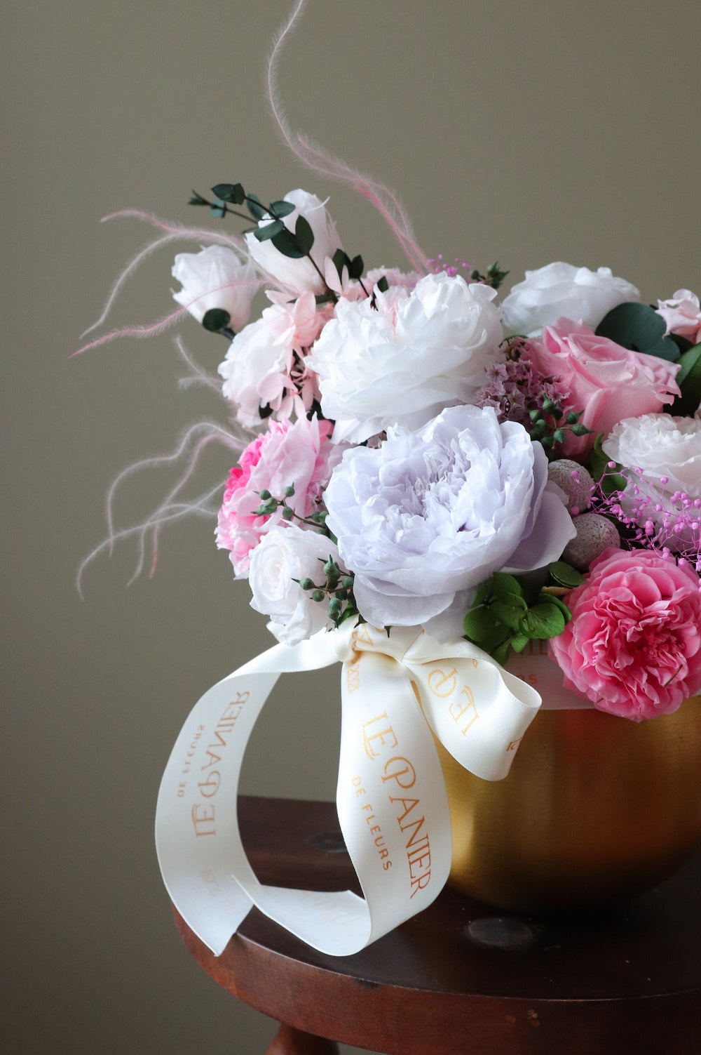 Preserved Flower arrangement in a gold round vessel featuring pink and purple garden roses